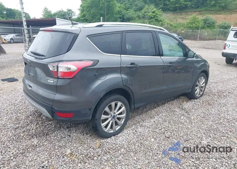 2017 Ford Escape Titanium z USA, uszkodzony, nr VIN 1FMCU0J99HUA84382